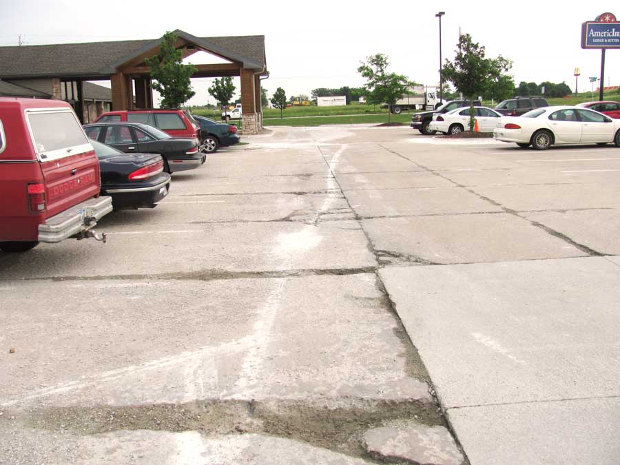 Hotel parking lot before asphalt repair
